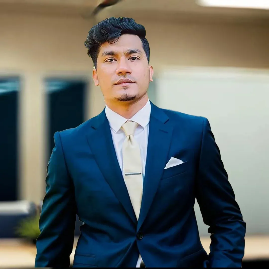Shakawat Hridoy, web developer, digital marketing strategist and AI automation specialist, in a navy suit with a cream tie and pocket square